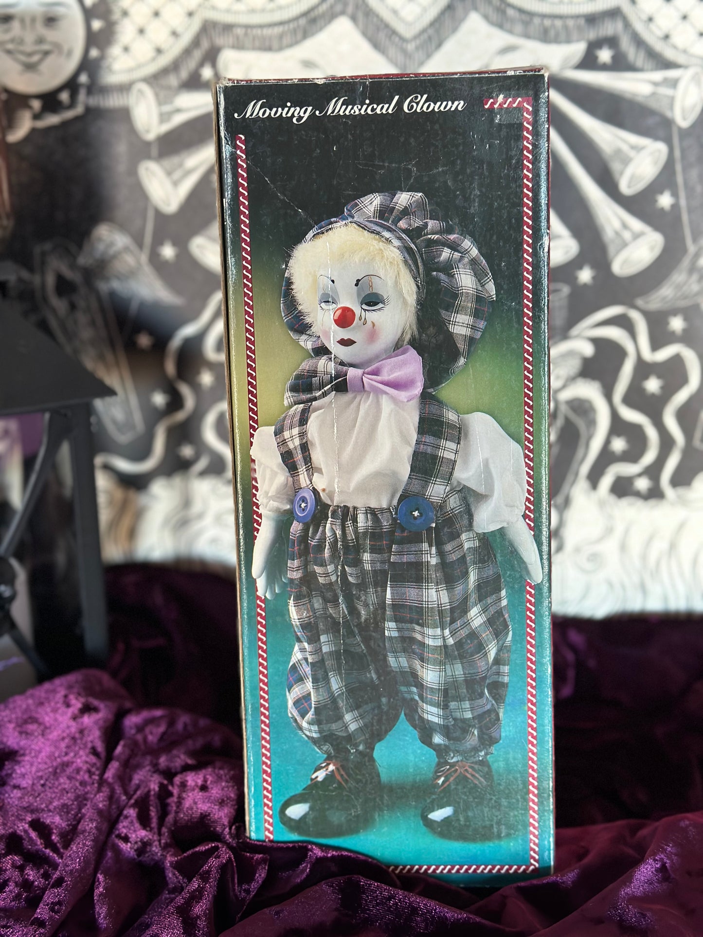 Vintage musical creepy clown doll