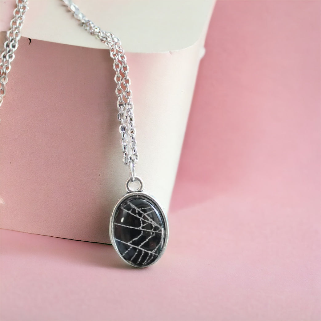 Small spider web necklace oddity